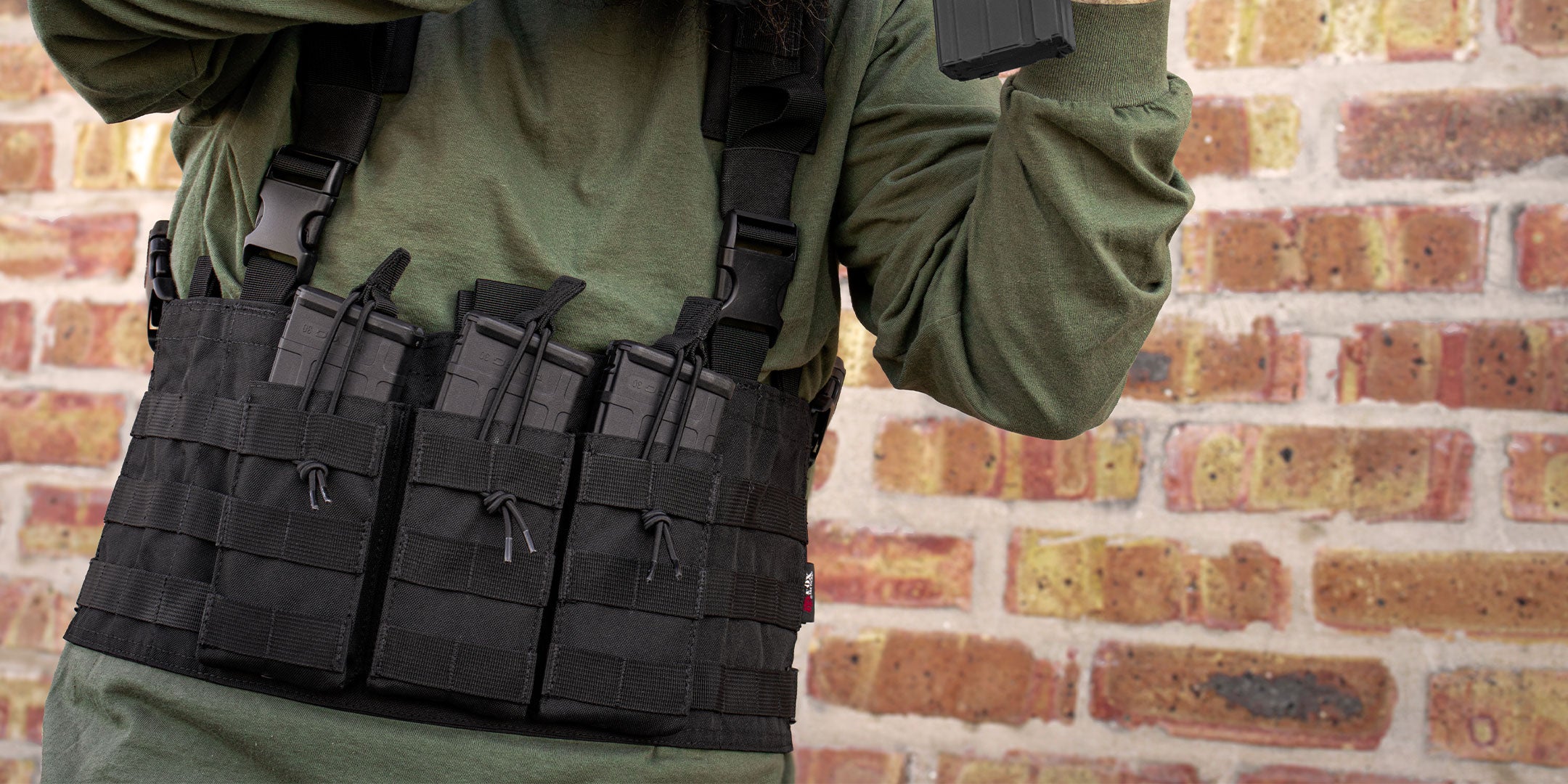 Closeup of the Tactical Chest rig on person holding weapon