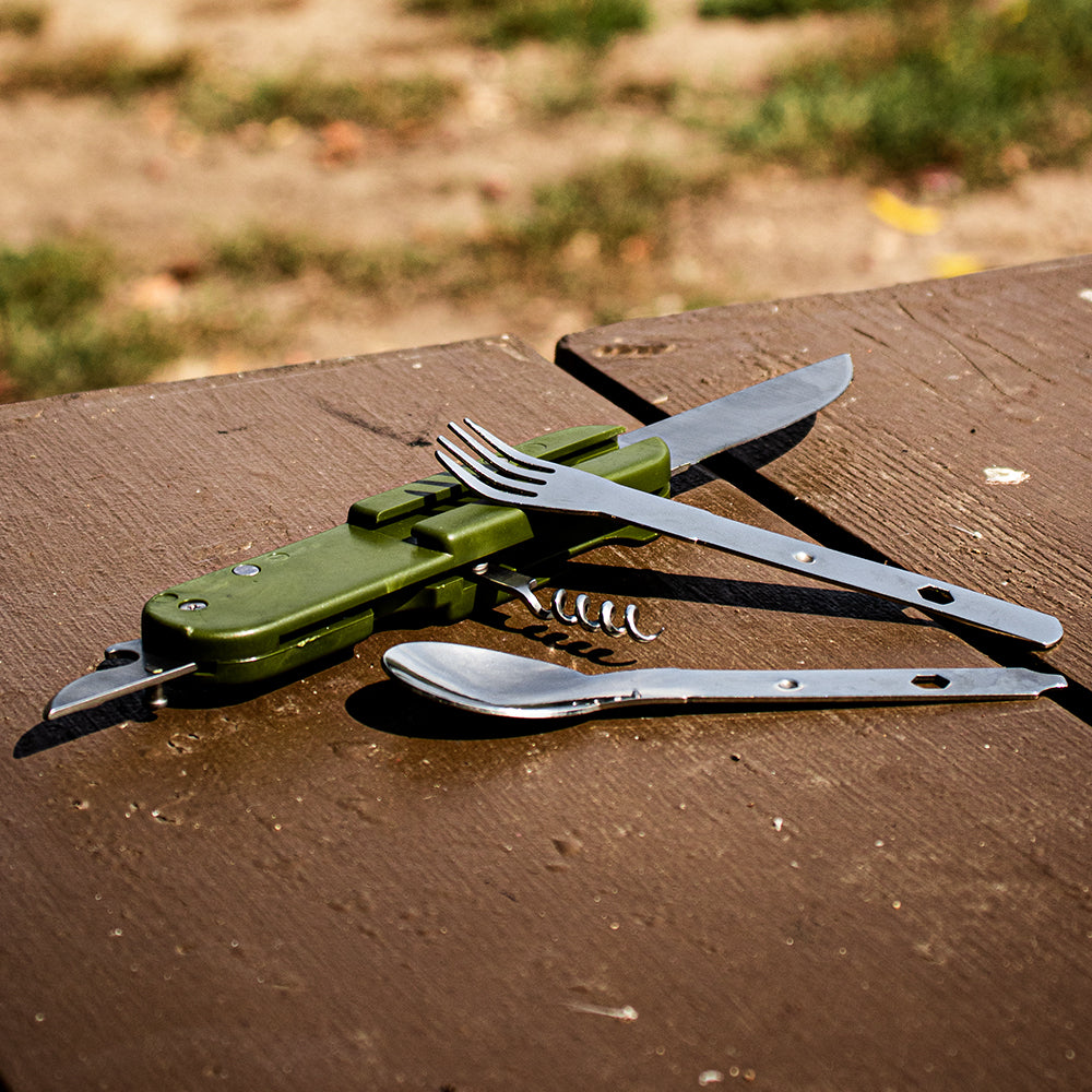 European 4-In-1 Chowset with fork and spoon tools out on top of an outdoor picnic table.