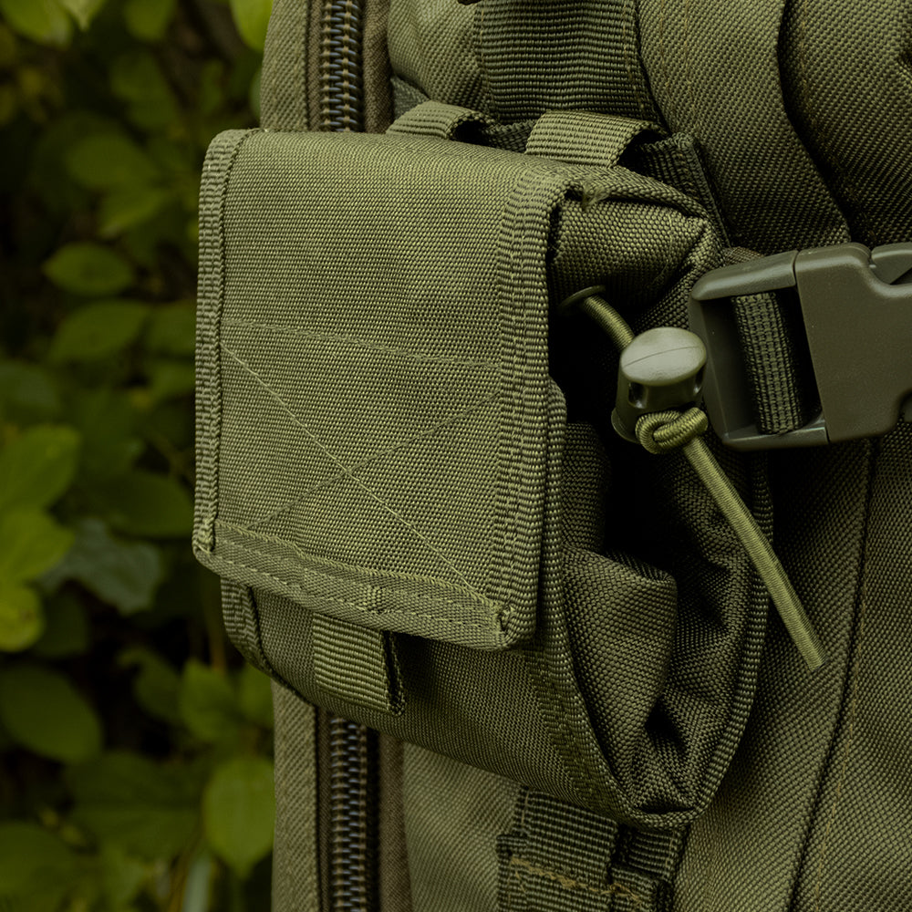 Close-up of Micro Ammo/Dump Pouch folded up attached via modular web straps to the side of a tactical backpack. 