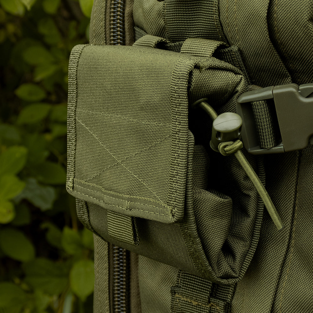 Close-up of Micro Ammo/Dump Pouch folded up attached via modular web straps to the side of a tactical backpack.