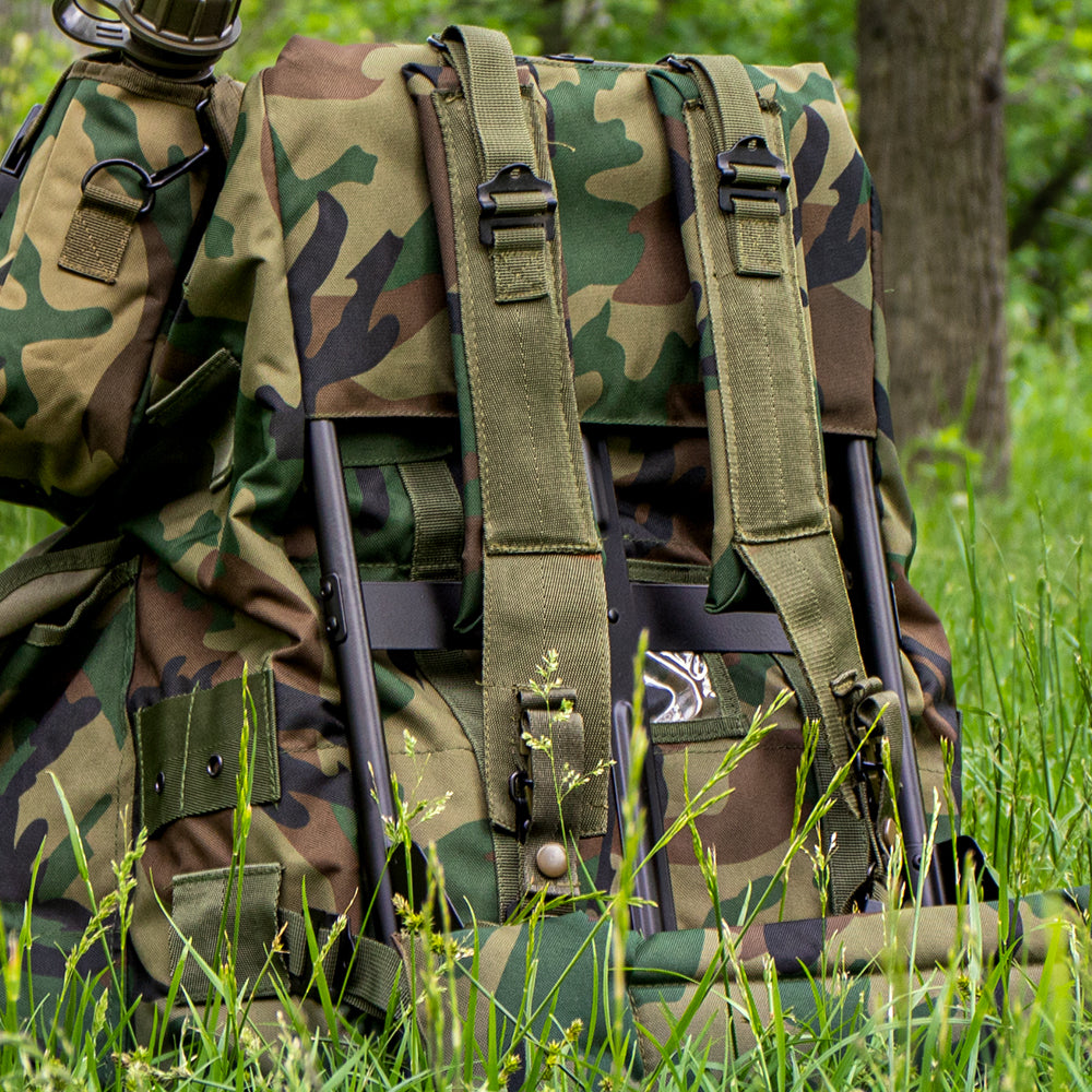 LC-1 A.L.I.C.E. Field Pack Frame with an A.L.I.C.E. pack attached laying in a grassy field. 