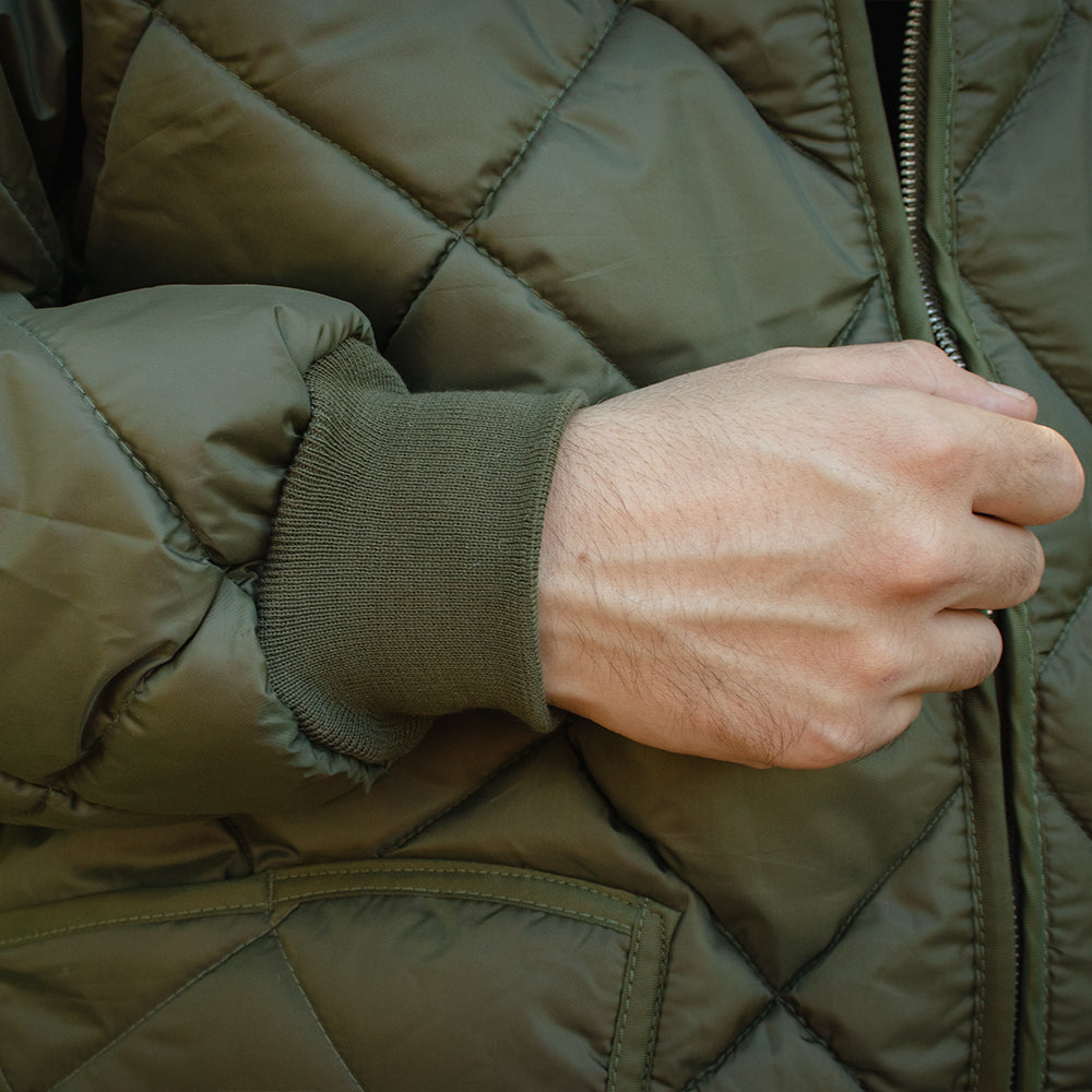 Close-up of the Urban Utility Jacket being zipped up.