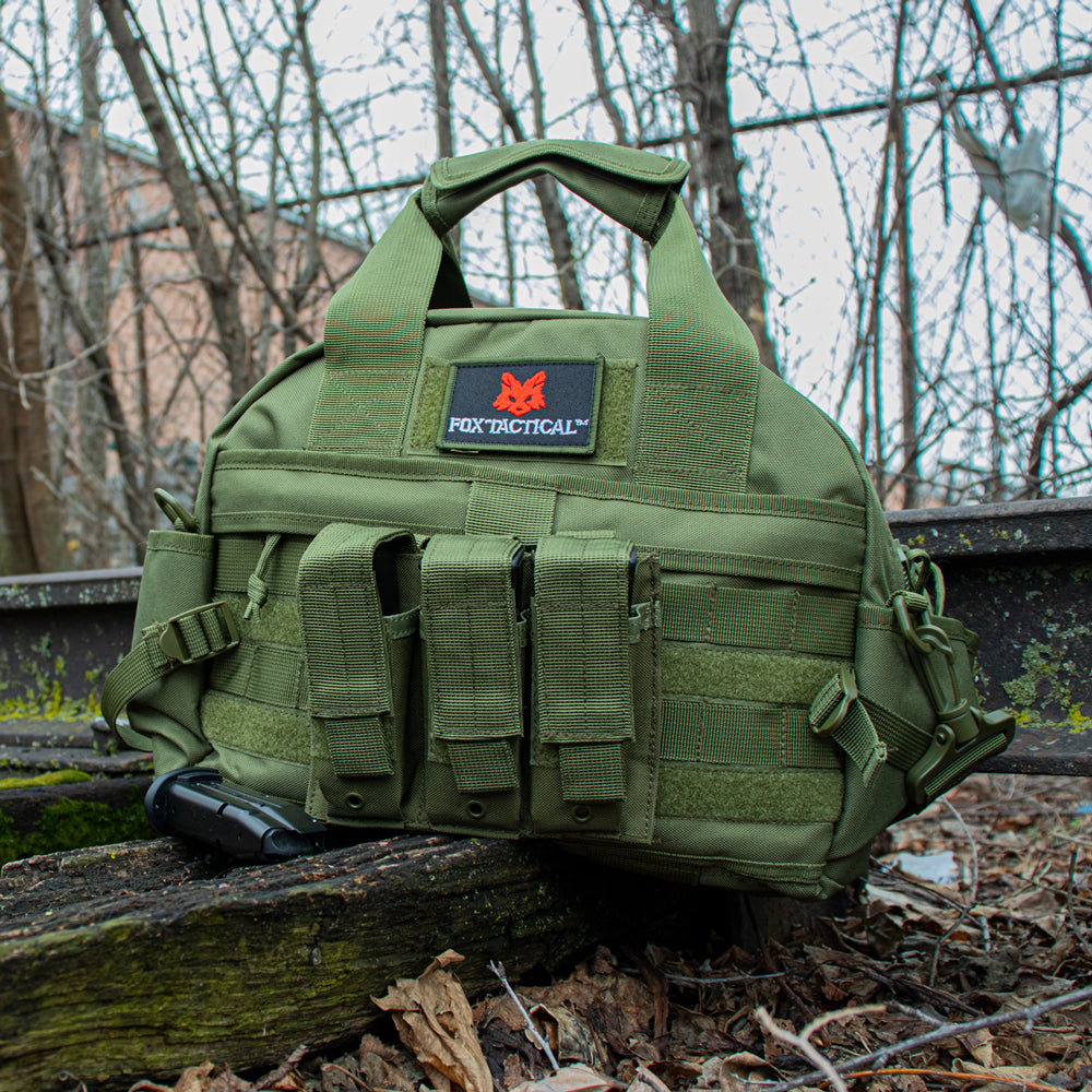 Field & Range Tactical Bag on abandoned train tracks with a pistol magazine in front.