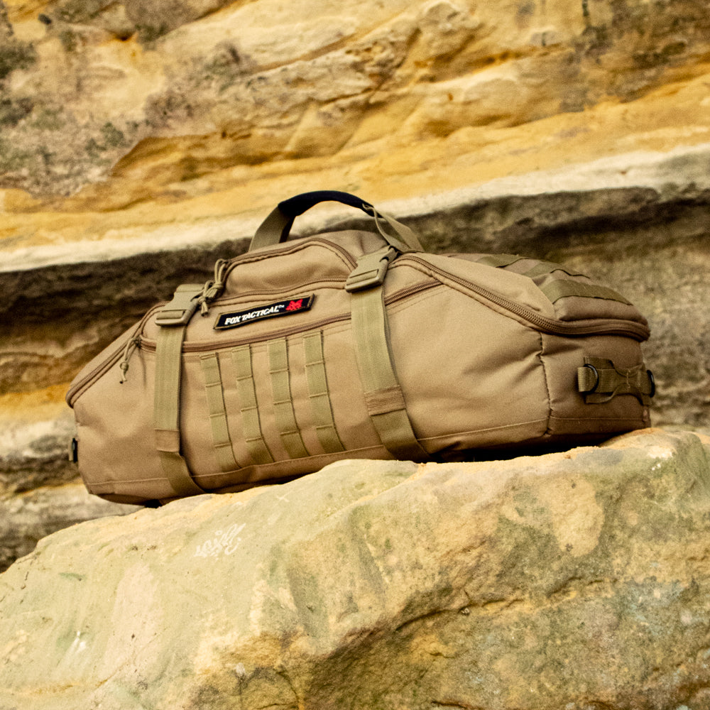 3-in-1 Recon Gear Bag perched on a rock in a sandstone cave.