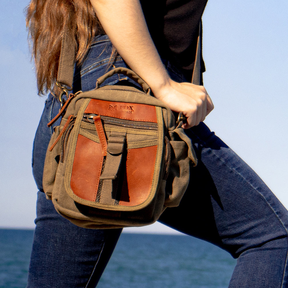 Woman wearing Classic Eurostyle “On The Go” Travel Organizer Bag in front of a large lake.