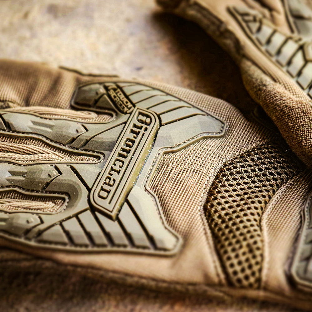 Close-up of Ironclad® EXO Tactical Impact Series Glove on limestone rock.