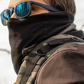 Man wearing Versatile Gaiter Tube that covers up his face up to his nose.