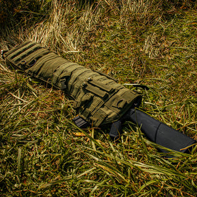 Tactical Assault Long Rifle Scabbard laying in a field of grass.