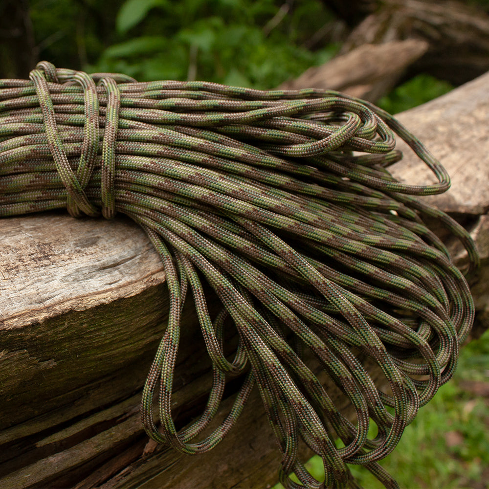 Close-up of Nylon Braided Paracord on top of a fallen tree.