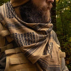 Man wearing a Tactical Shemagh outside in the woods.