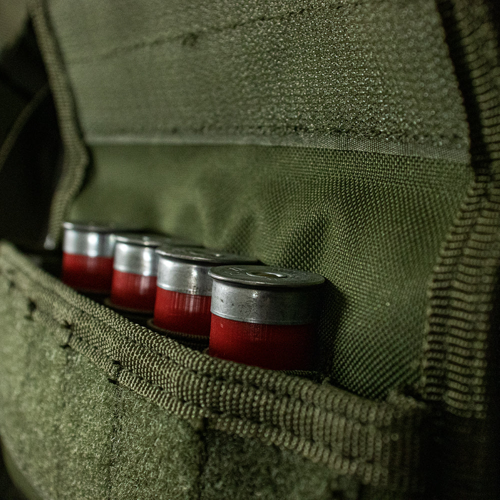 Close-up of Tactical Shotgun Ammo Pouch open with shotgun shells inside.