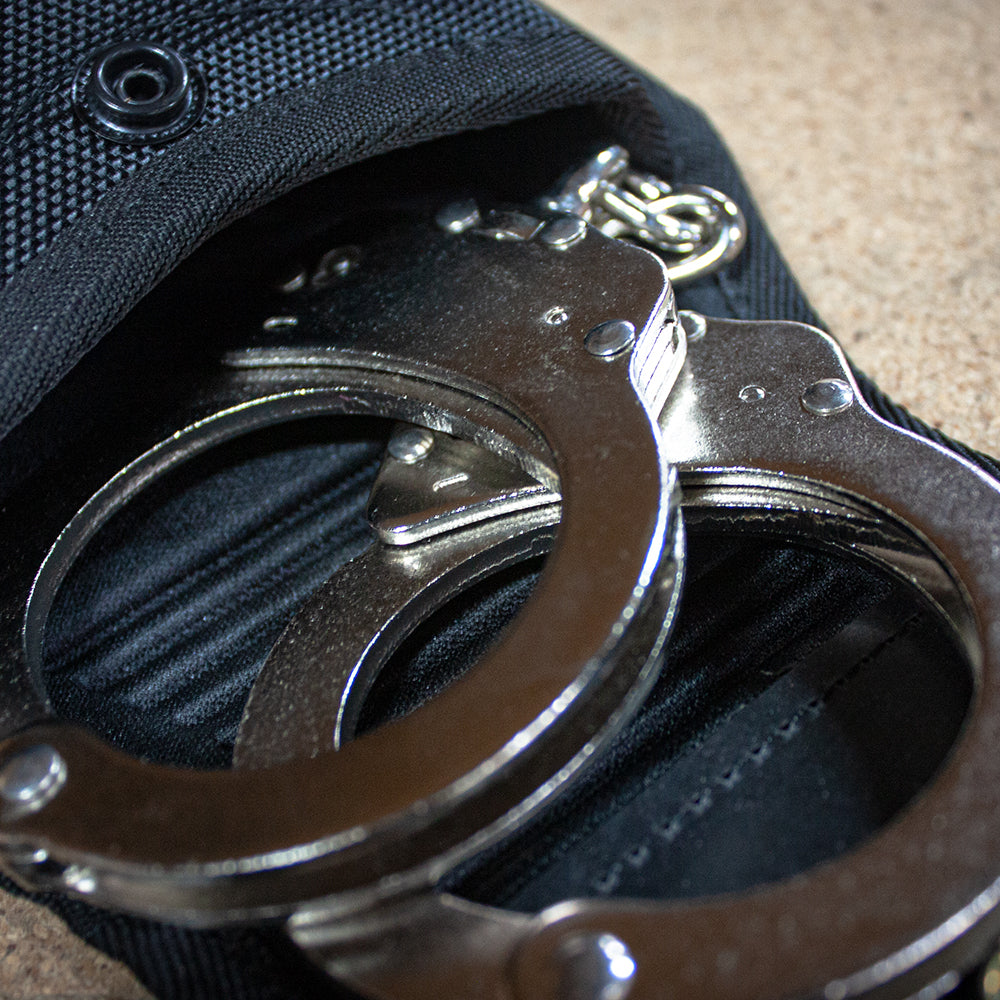 Close-up of Professional Series Duty Handcuff Case - Single open, with handcuffs inside.