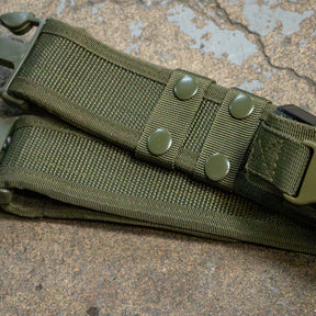 Close-up of Tactical Belt – 2.0 on a cracked pavement.