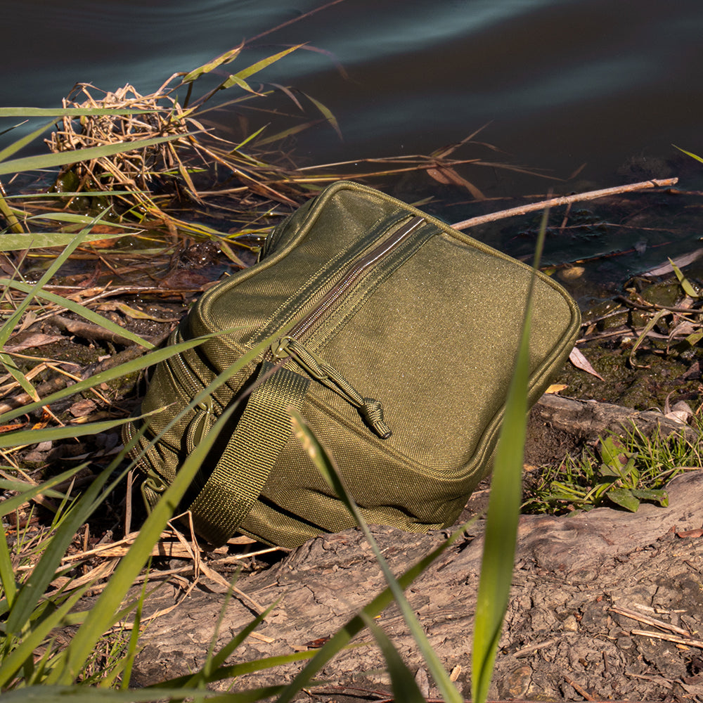 Soldier's Toiletry Kit near the shore of a lake.