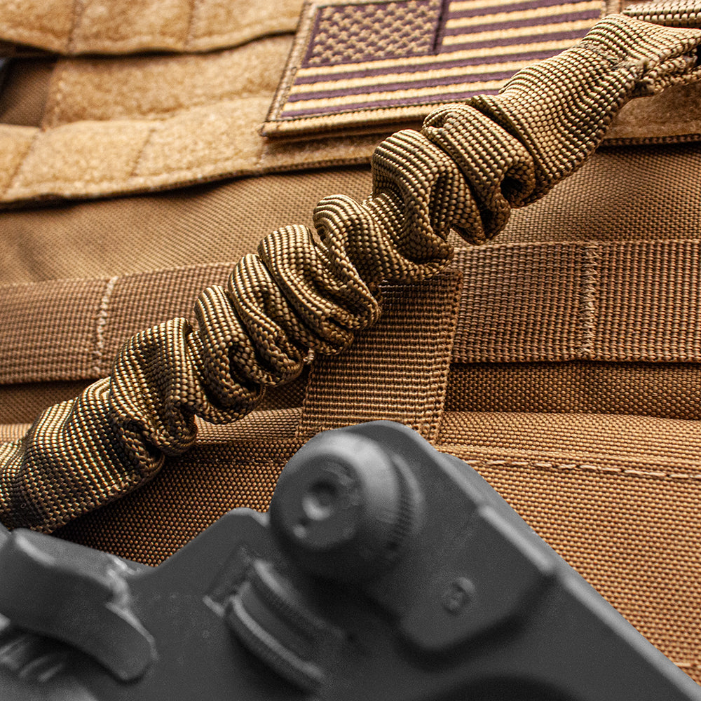 Closeup of Single Point Sling on a vest with a rifle.
