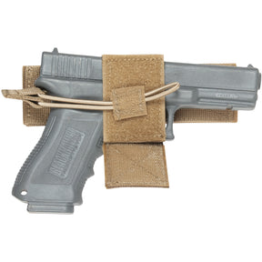 Universal Hook & Loop Holster with front flap off and a prop pistol inside.
