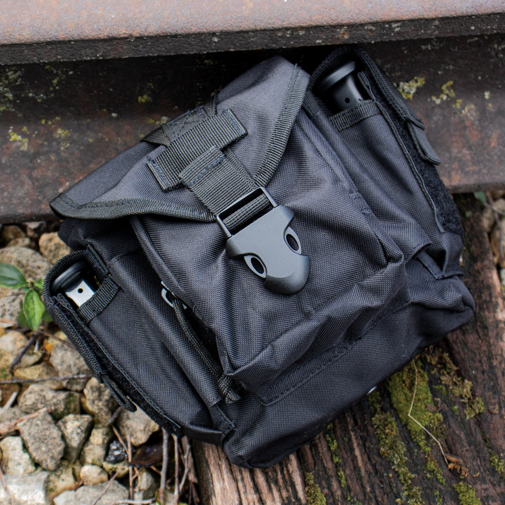 Close shot of Advanced Tactical Dump Pouch laying on an abandoned railroad line.