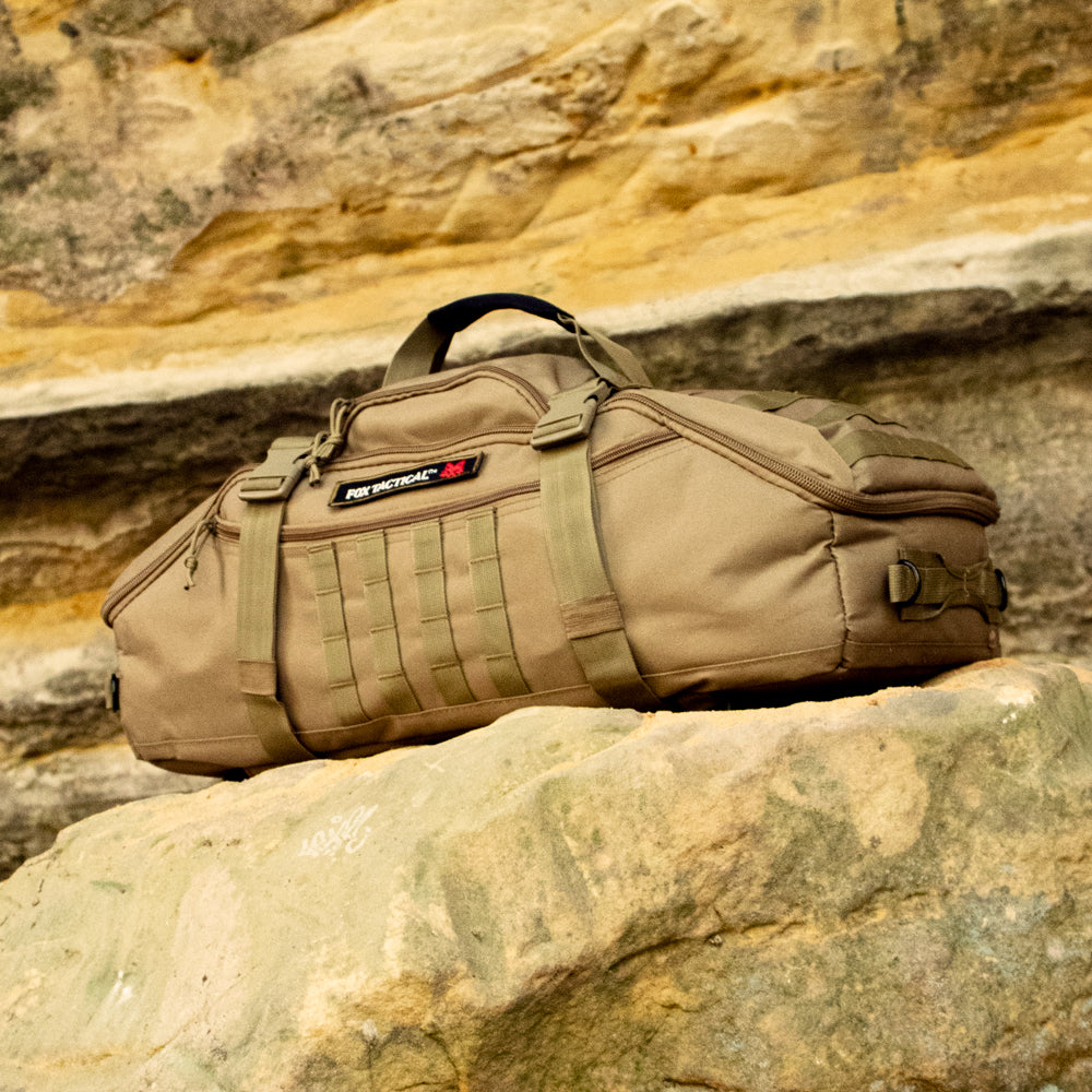 3-in-1 Recon Gear Bag perched on a rock in a sandstone cave. 