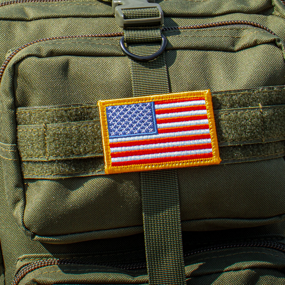 A USA Flag patch on a modular hook and loop strip.