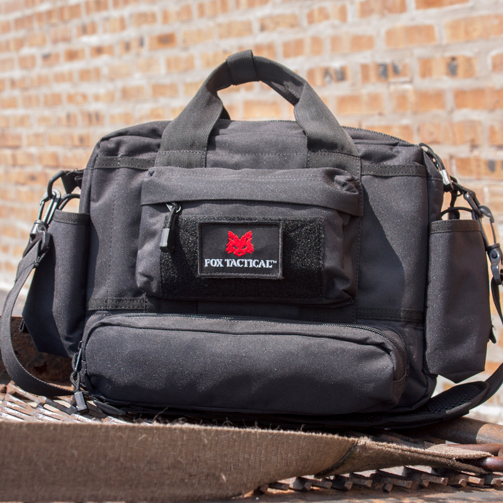 Mission Response Bag on a truck bed in front of a brick wall.